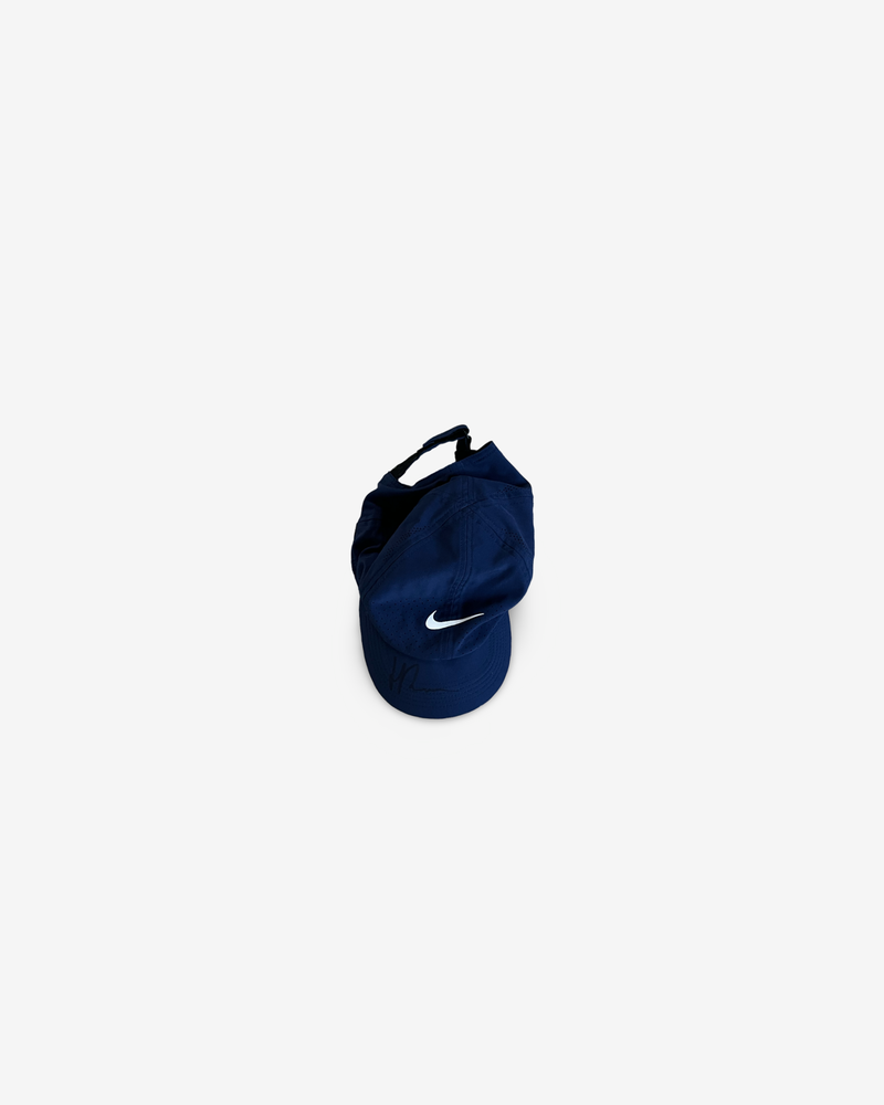Dark blue match and practice cap, signed