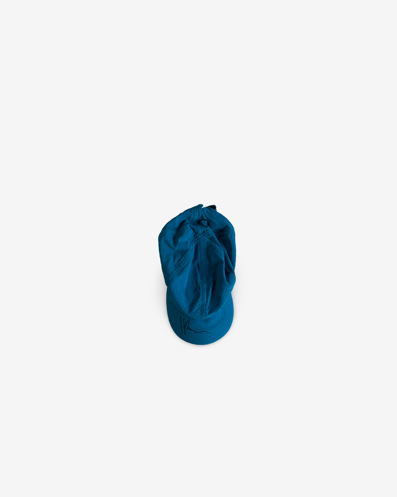 Petroleum blue match and practice cap, signed