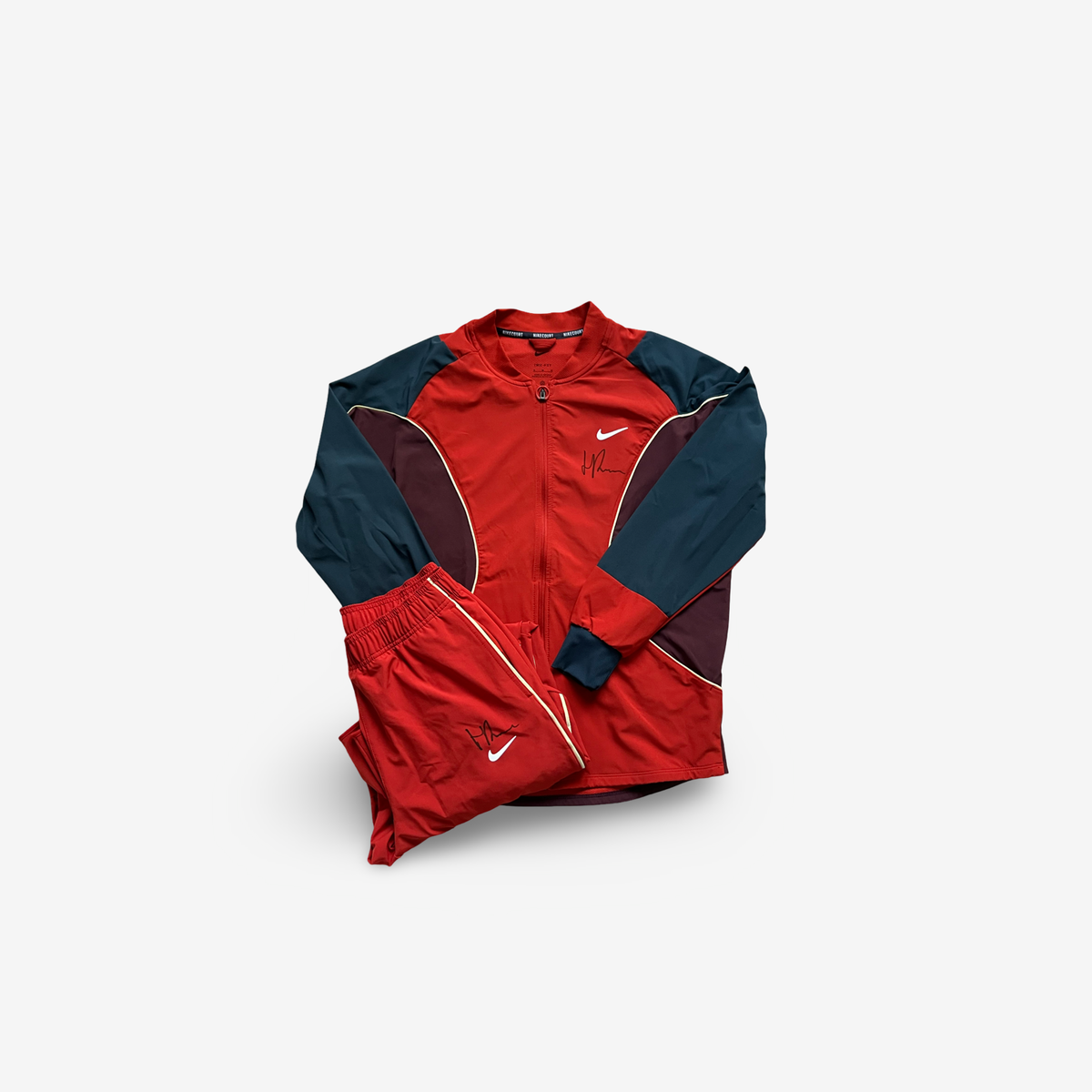 Red track suit , signed