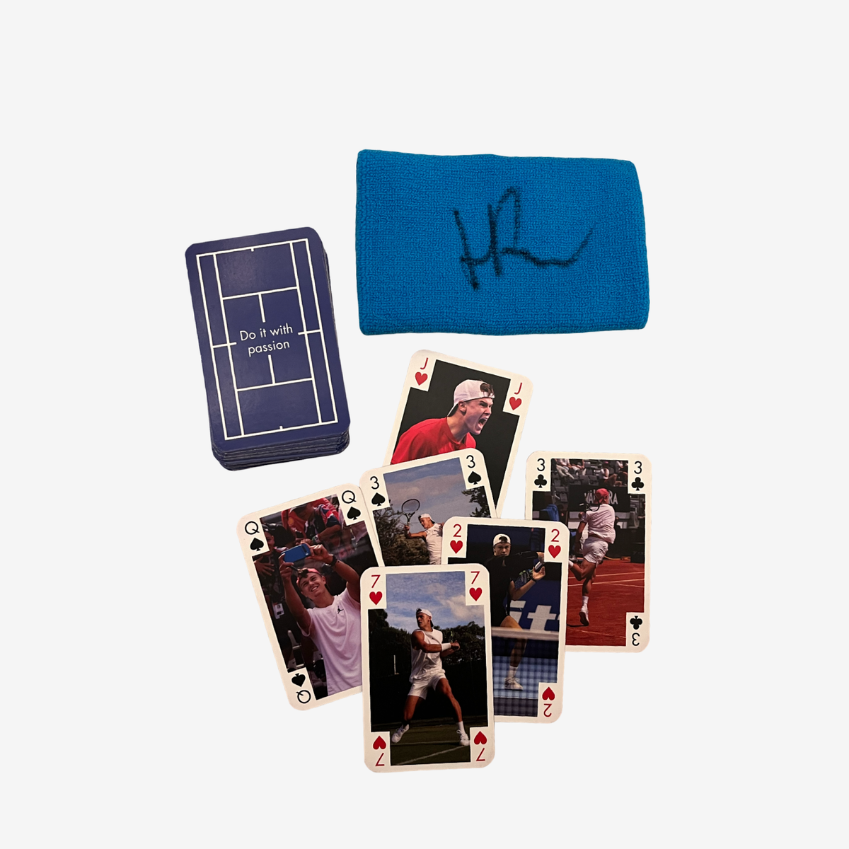 One signed used wristband and card game