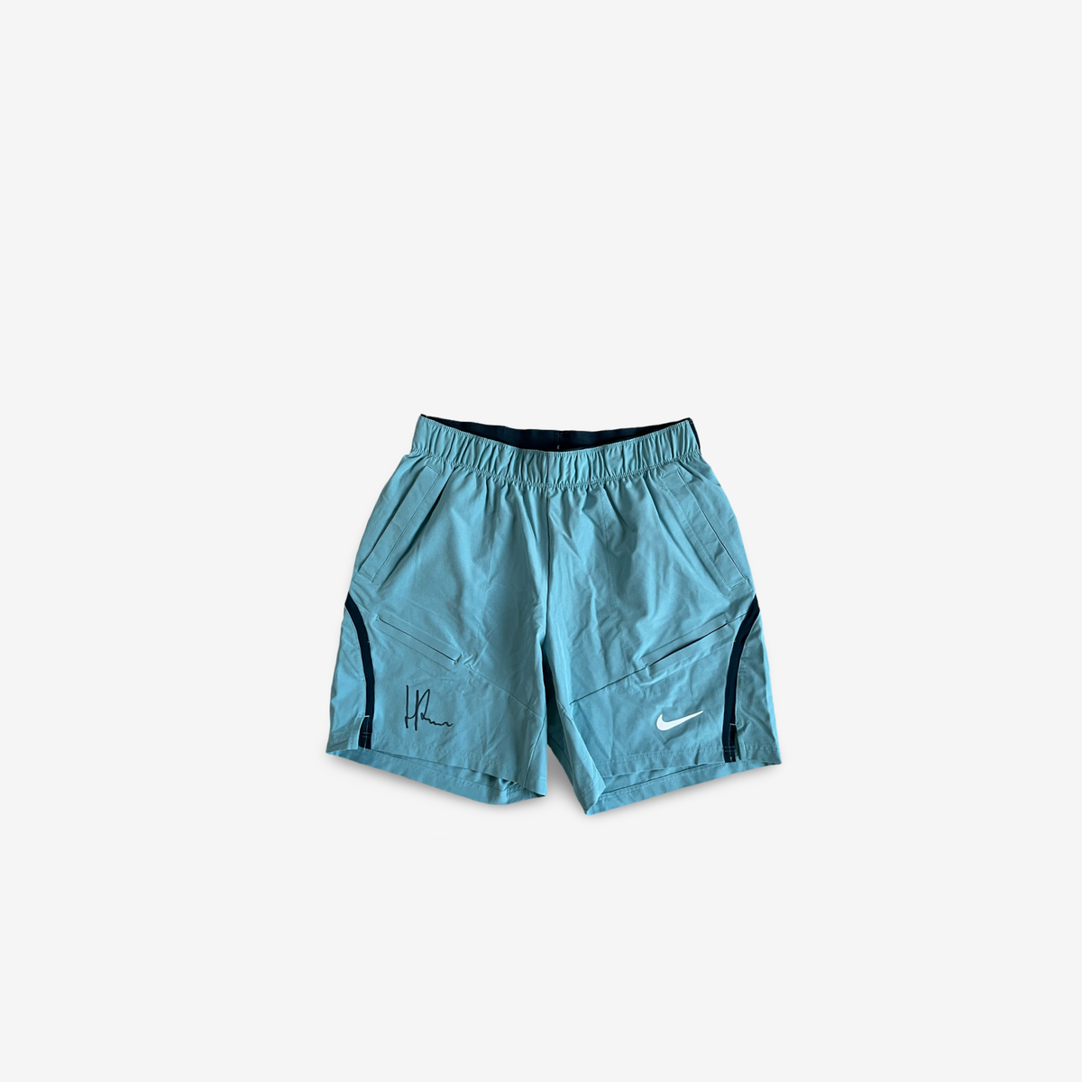 Blue practice and match shorts, signed