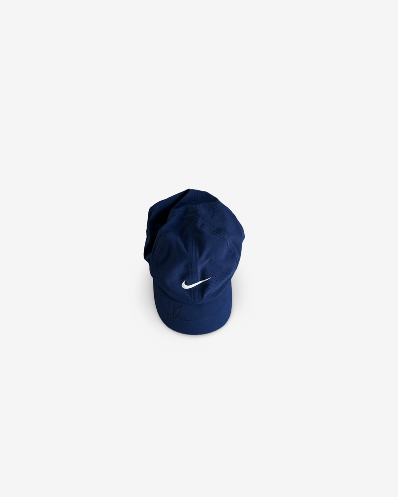 Dark blue match cap, signed