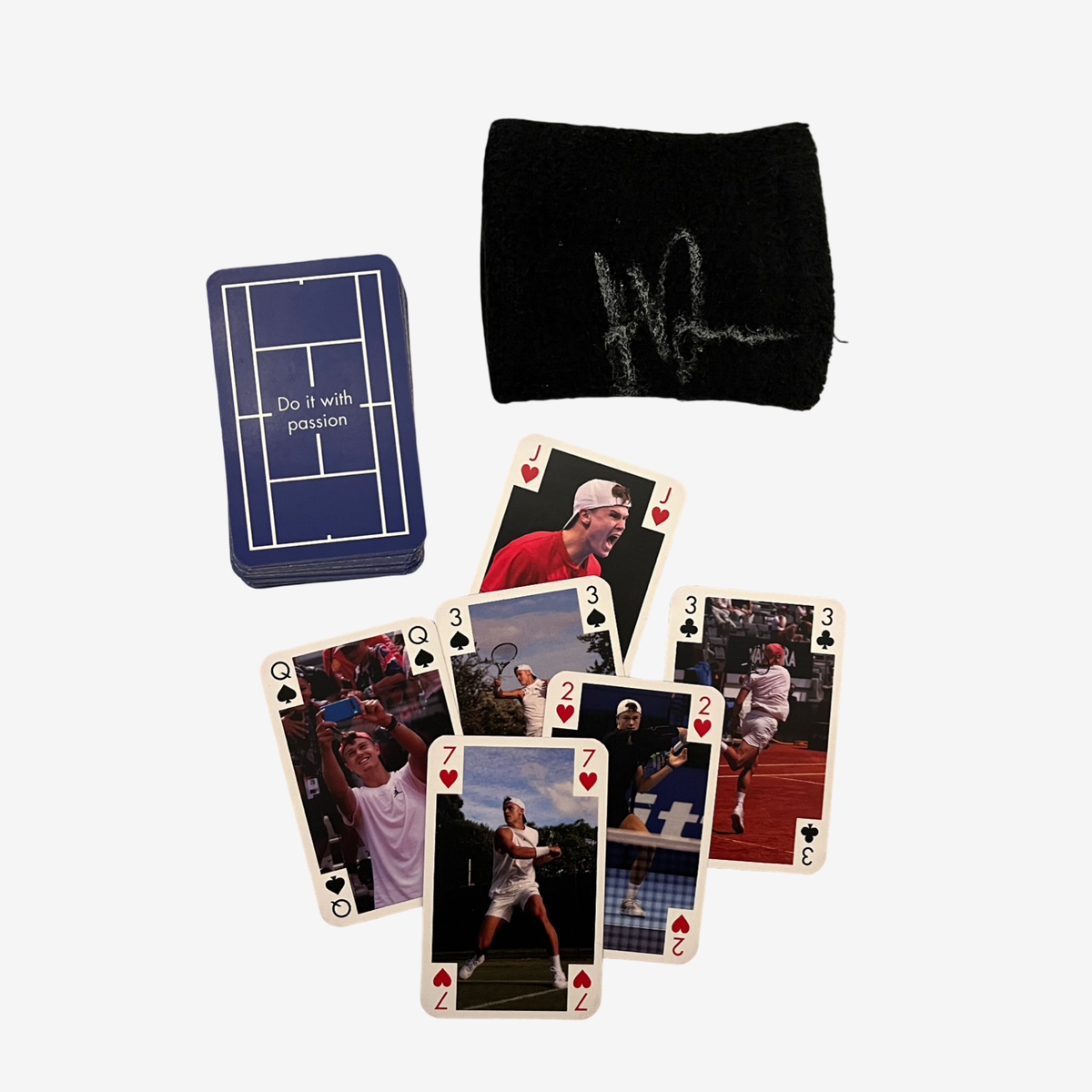 One black signed used wristband and card game