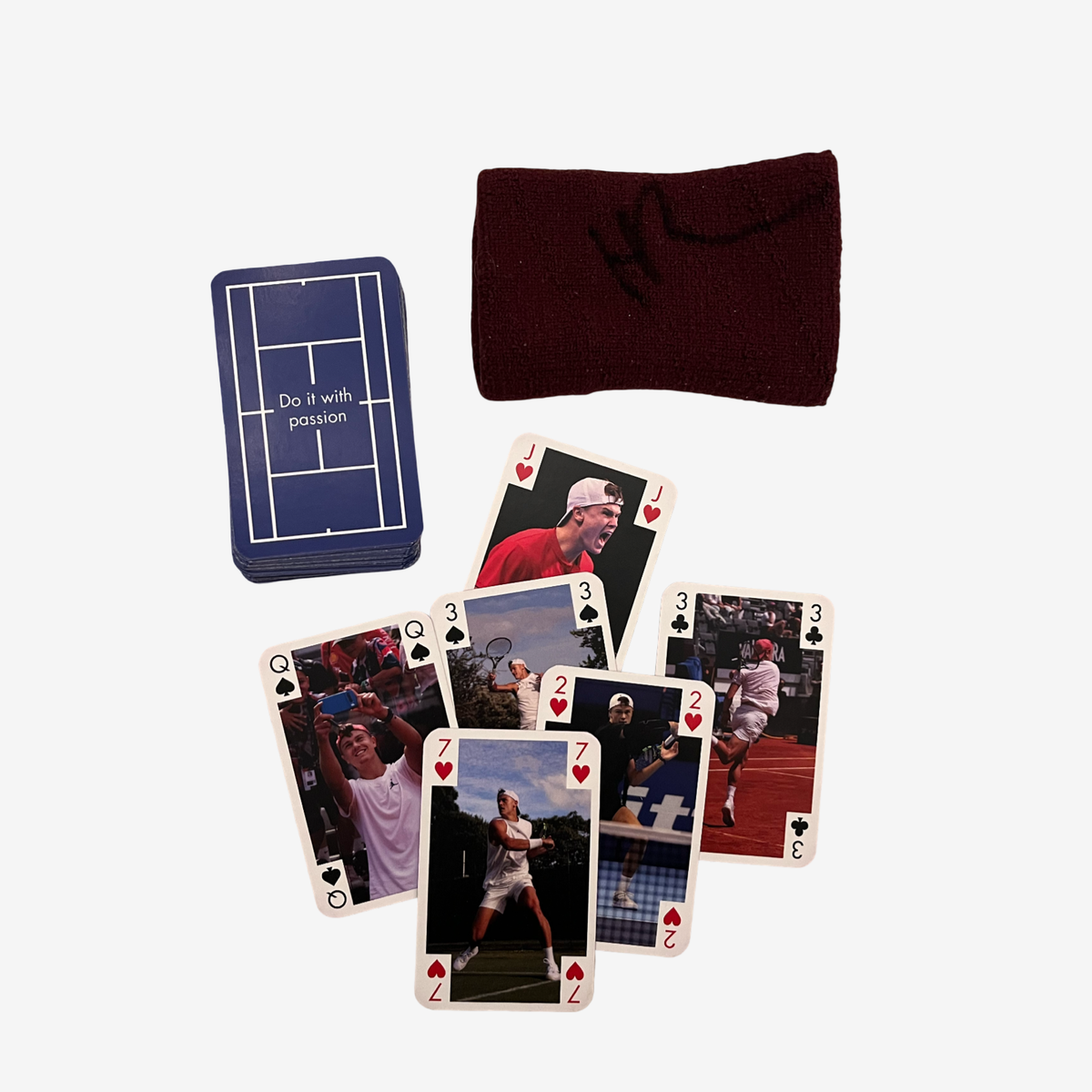 One signed used wristband, burgundy and card game