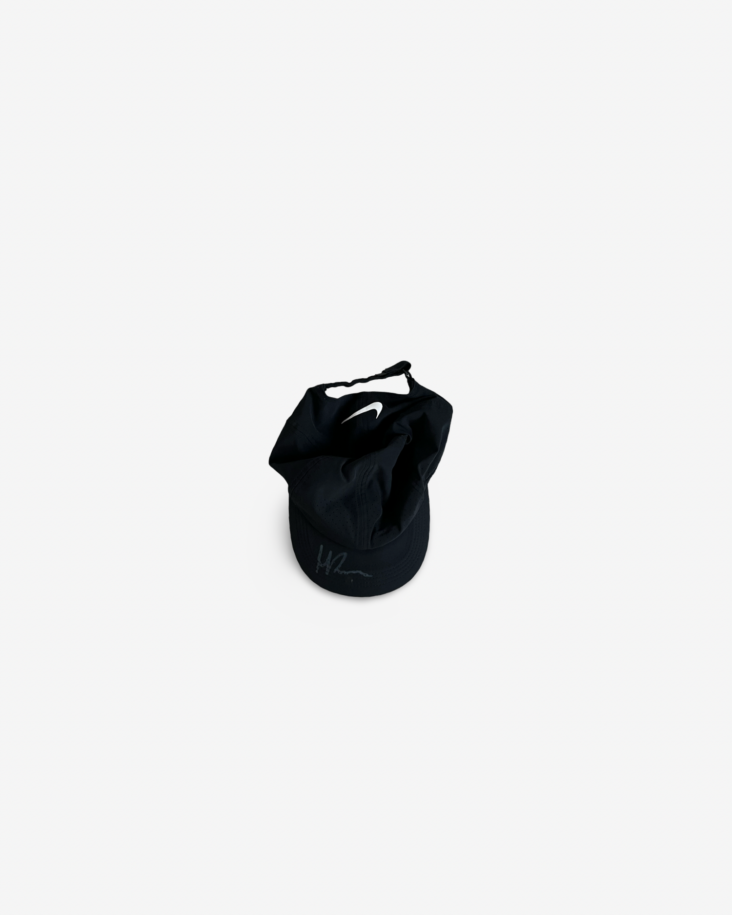 Black match and practice cap, signed