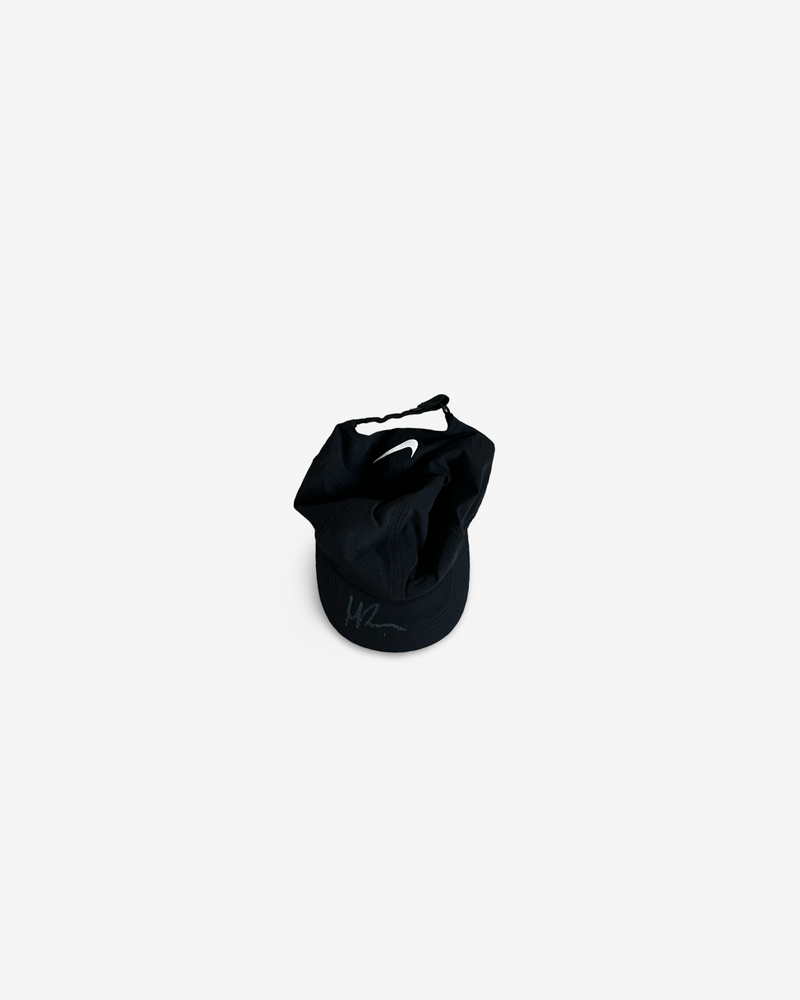 Black match and practice cap, signed