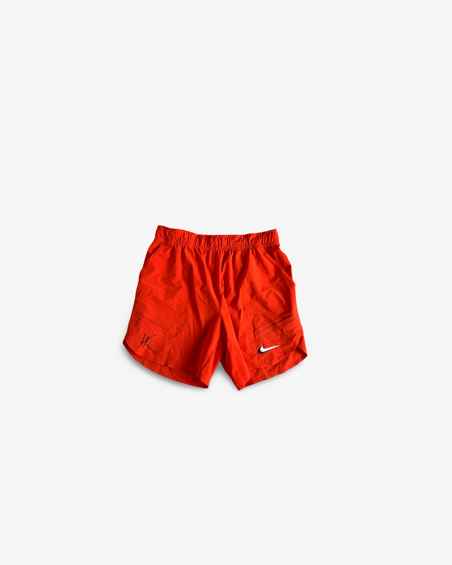 Orange practice and match shorts , signed