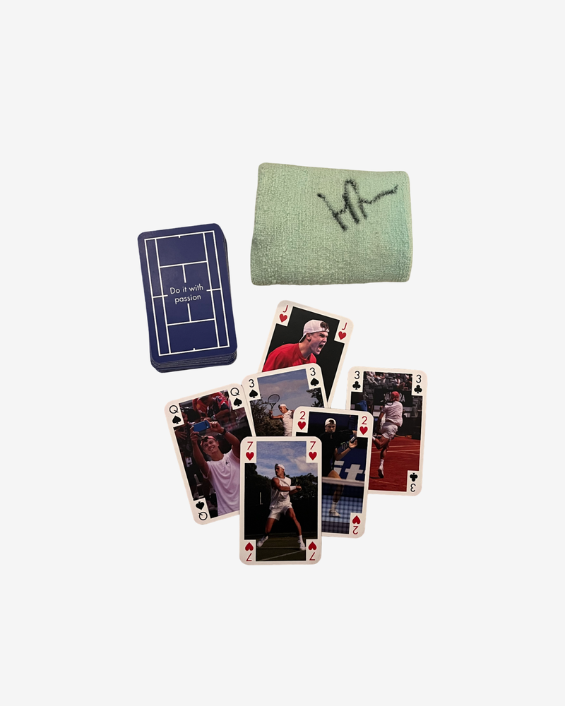 One signed match used mint green wristband and card game
