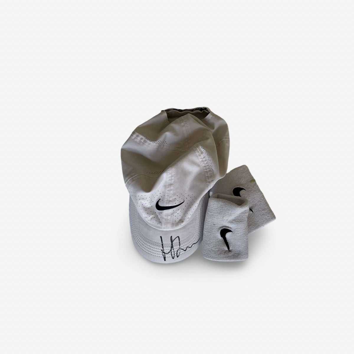 White match cap, signed and wristbands