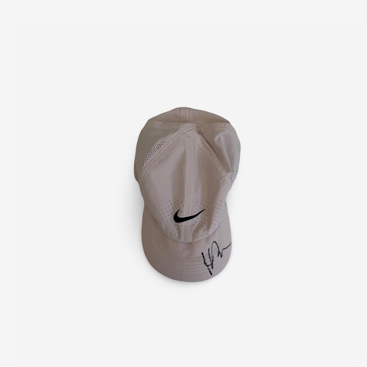 White cap, signed and very used in clay season
