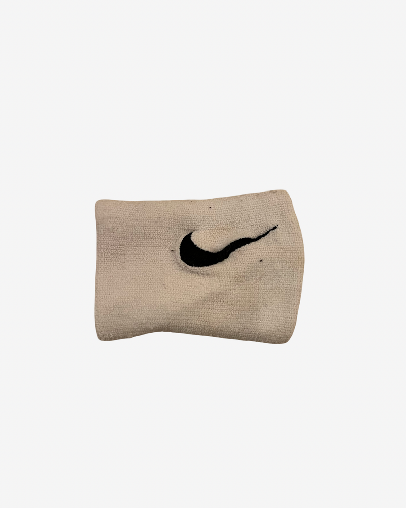 One white used wristband, signed