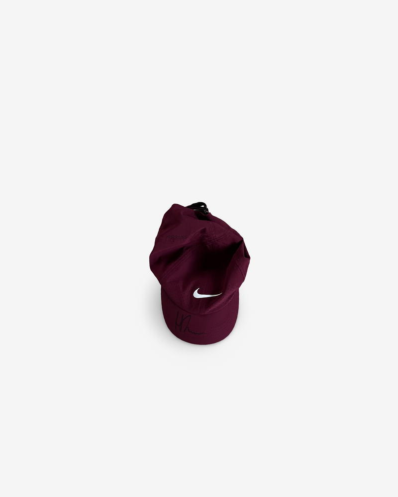 Burgundy match and practice cap, signed