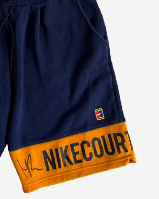 Dark blue and orange off court shorts, signed