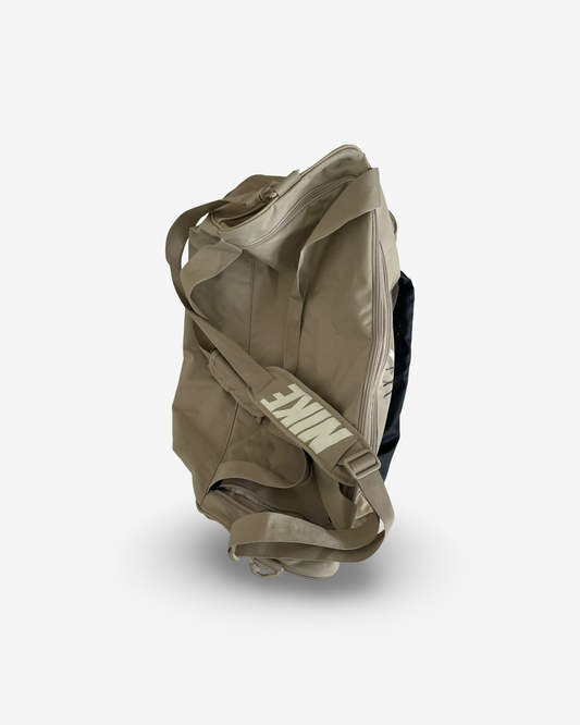 Beige tennis bag, fits rackets. Signed