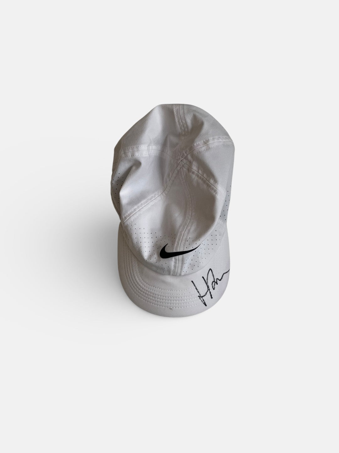 Signed match used white cap